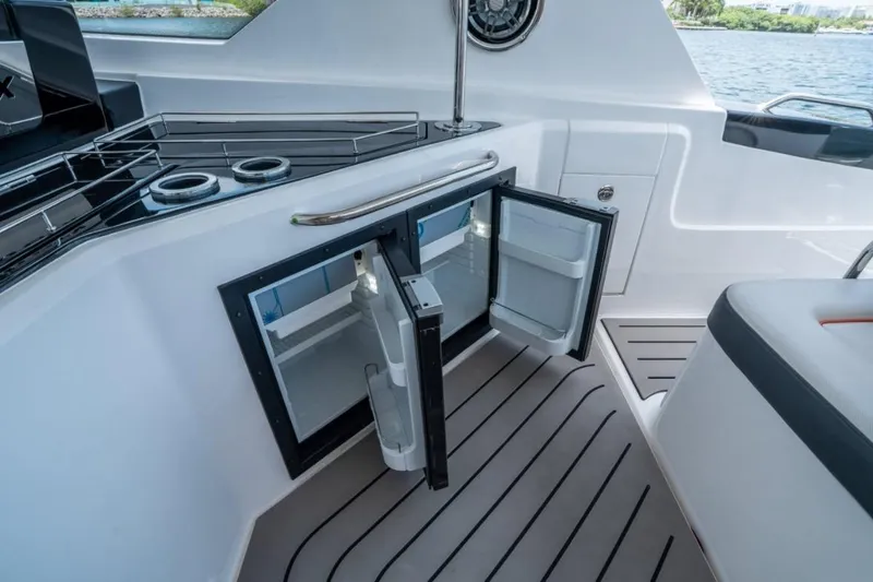 Slide: The Image of Luxurious seating area on the 2026 Granfort 37 GTX yacht with striped cushions. - 10