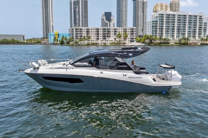 Slide: The Image of 2026 Granfort 37 GTX luxury boat cruising on open water. - 2