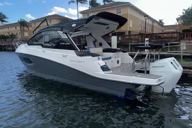 Slide: The Image of Luxurious interior of 2026 Granfort 37 GTX yacht with cozy seating and dining area. - 24