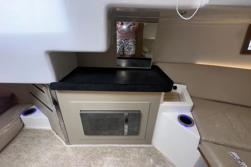 Slide: The Image of 2026 Granfort 37 GTX boat deck with cushioned seating and water view. - 36