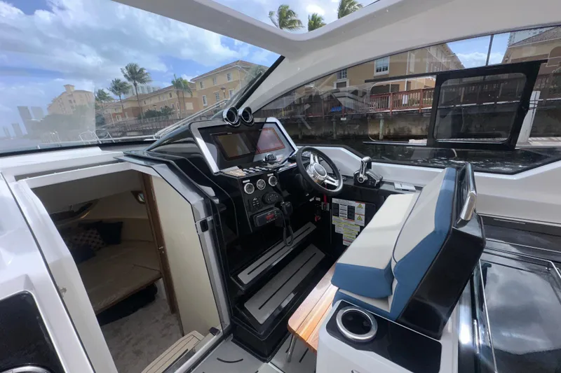 Slide: The Image of Granfort 37 GTX 2026 boat with dual Mercury engines on open water. - 39