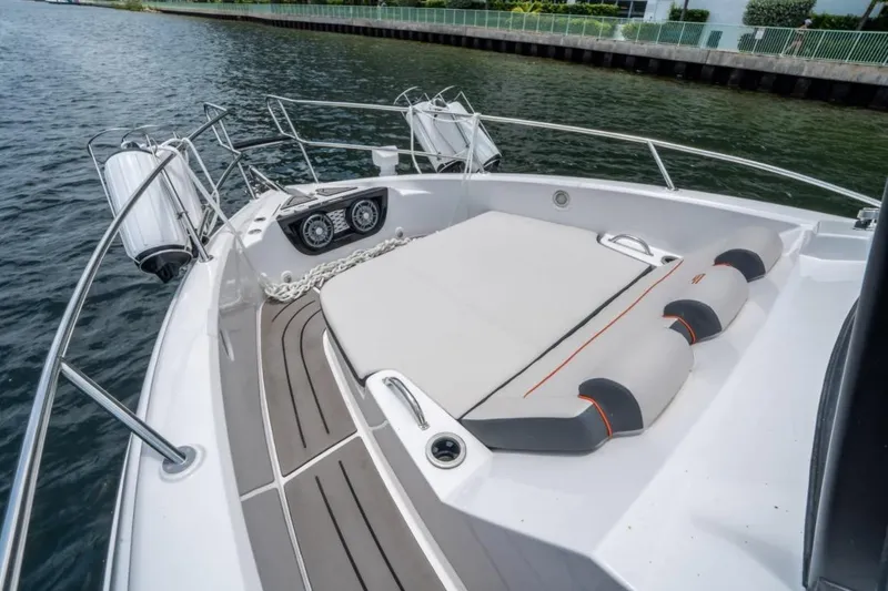 Slide: The Image of Granfort 37 GTX 2026 boat docked in a scenic marina with clear skies. - 5