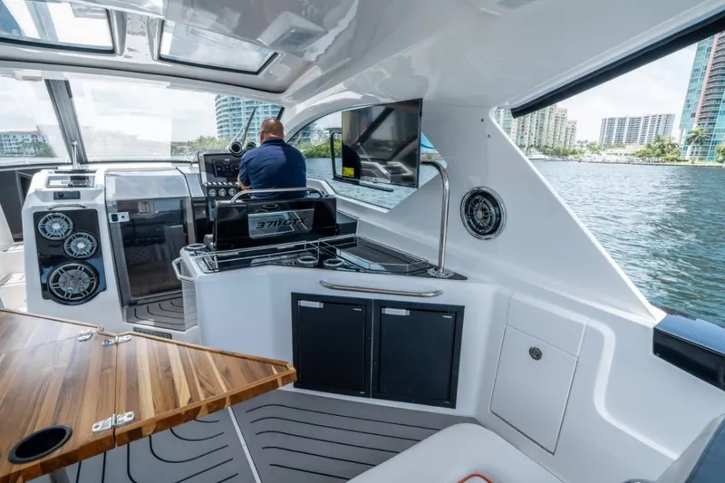 Slide: The Image of 2026 Granfort 37 GTX luxury yacht docked at marina under cloudy sky. - 7