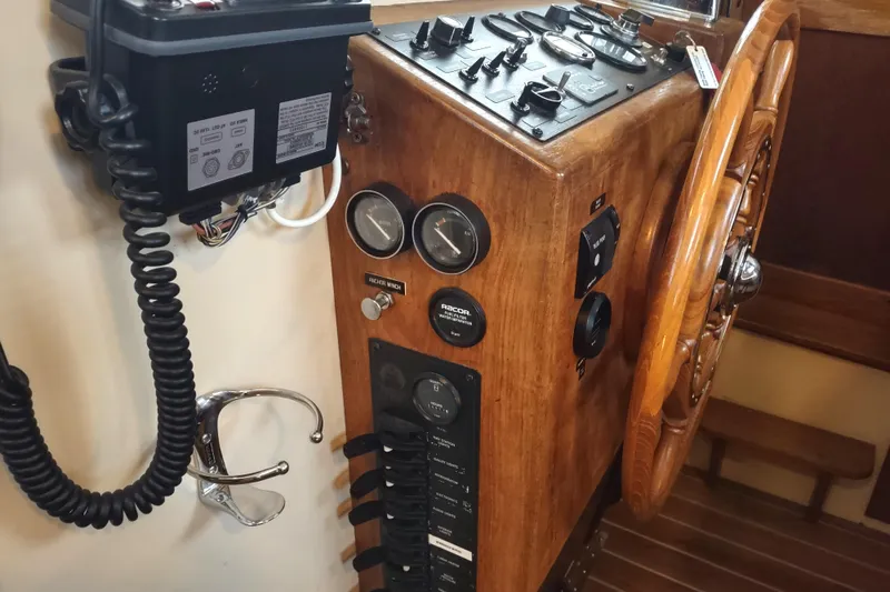 Slide: The Image of Control panel of a 1990 Nordic Tug 32 with navigation and communication equipment. - 36