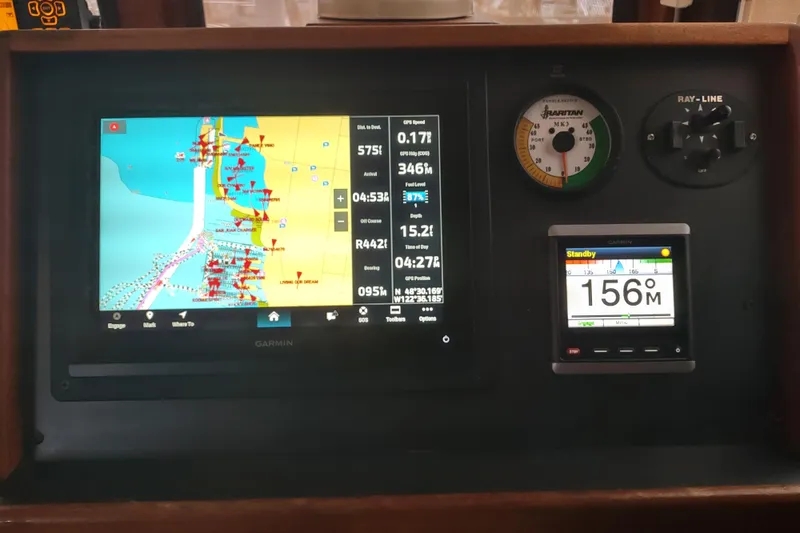 Slide: The Image of Navigation equipment on a 1990 Nordic Tug 32, featuring GPS and radar displays. - 42
