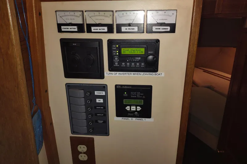 Slide: The Image of Navigation dashboard of a 1990 Nordic Tug 32 with Garmin display and instruments. - 43