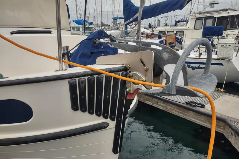 Slide: The Image of Binders labeled "Dobro Maintenance" on a Nordic Tug 32, 1990 model, wooden interior. - 53