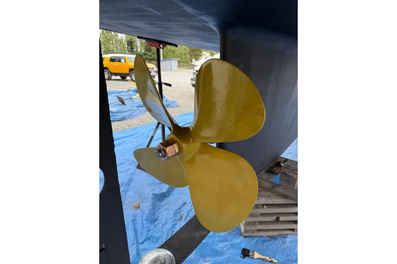 Slide: The Image of Close-up of a 1990 Nordic Tug 32 hull detail with protective cover. - 67