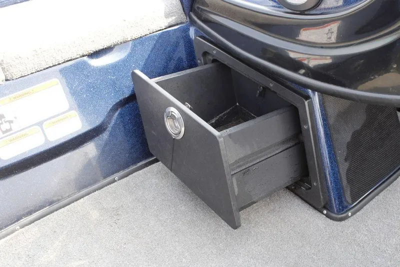 Slide: The Image of Open storage compartment in a 2015 Nitro Z-9 boat interior. - 17