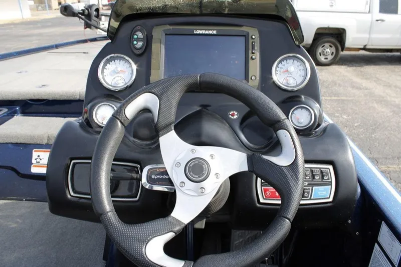 Slide: The Image of Steering console of a 2015 Nitro Z-9 boat with gauges and controls. - 20