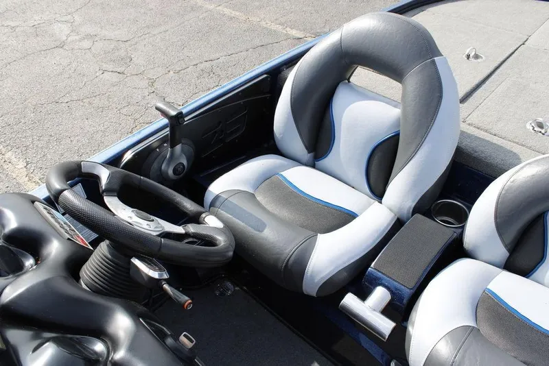Slide: The Image of Interior of 2015 Nitro Z-9 boat with steering wheel and cushioned seats. - 22