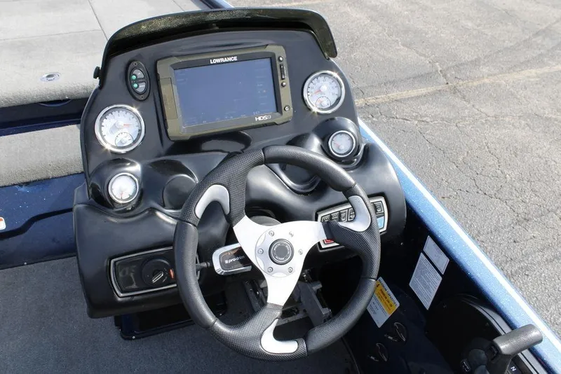 Slide: The Image of Steering console of a 2015 Nitro Z-9 boat with gauges and navigation system. - 24