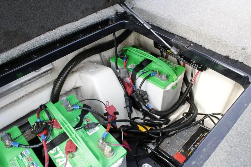 Slide: The Image of 2015 Nitro Z-9 boat battery compartment with green batteries and wiring. - 26