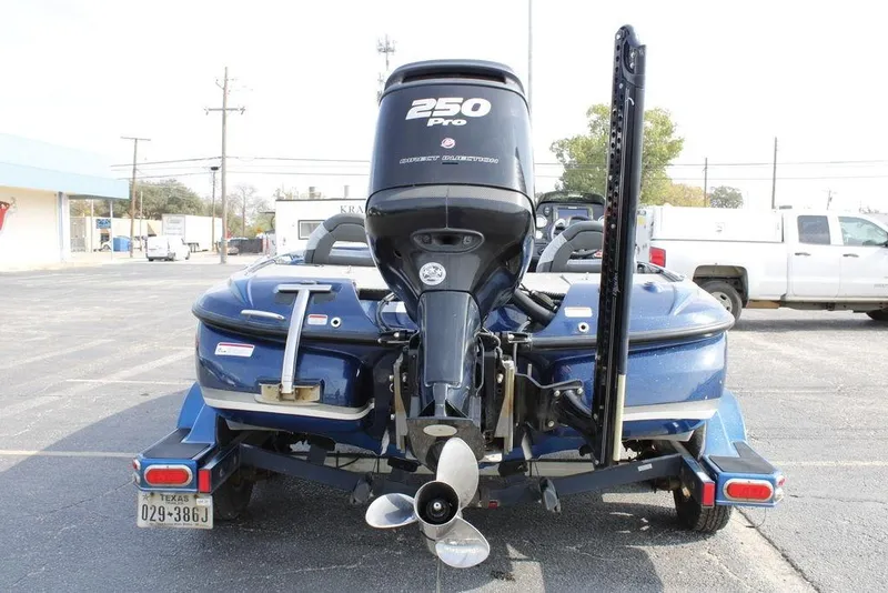 Slide: The Image of 2015 Nitro Z-9 boat with 250 Pro motor, parked on a trailer in a lot. - 4