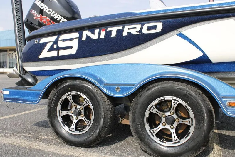 Slide: The Image of 2015 Nitro Z-9 boat trailer with dual wheels and Mercury engine. - 9