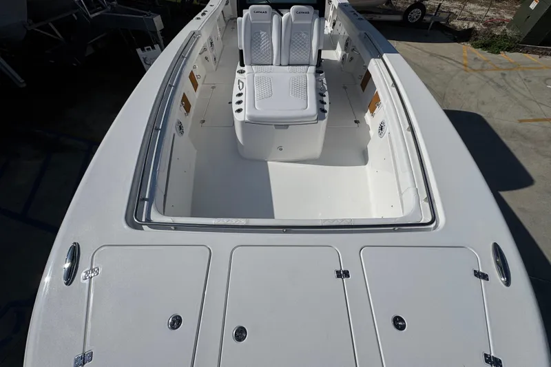 Slide: The Image of 2026 Caymas 30 CT boat with spacious deck and seating area. - 16