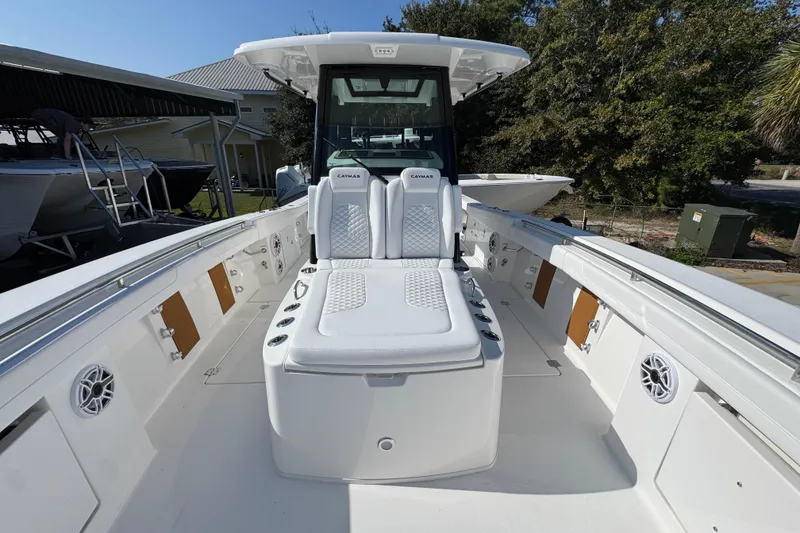 Slide: The Image of 2026 Caymas 30 CT boat interior with white seating and modern design. - 18