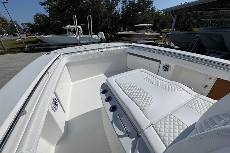Slide: The Image of 2026 Caymas 30 CT boat interior with white cushioned seating and sleek design. - 19