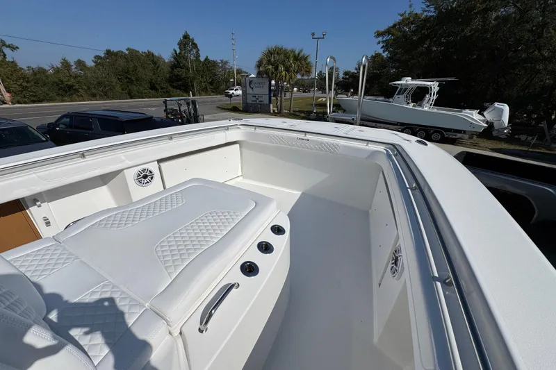 Slide: The Image of 2026 Caymas 30 CT boat interior with white seating and sleek design. - 20