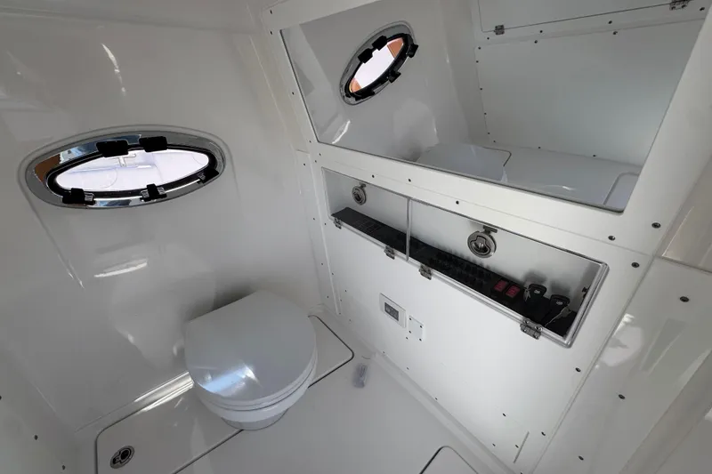 Slide: The Image of 2026 Caymas 30 CT boat interior with modern bathroom and storage features. - 25