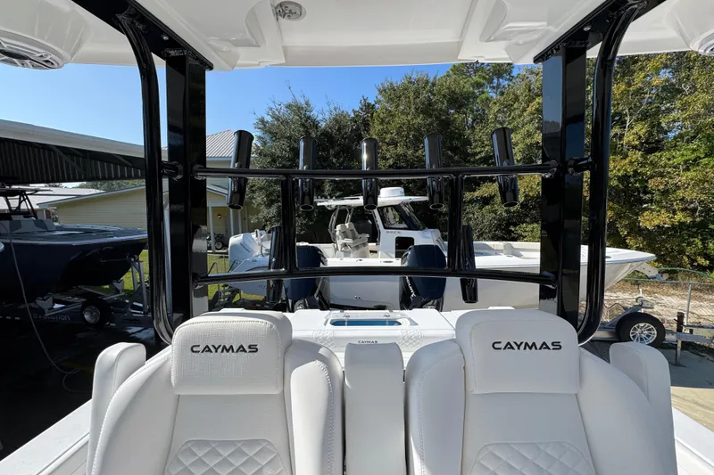 Slide: The Image of 2026 Caymas 30 CT boat interior with branded seats and rod holders. - 28