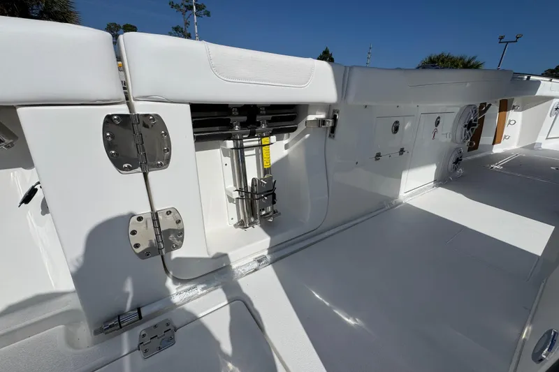 Slide: The Image of 2026 Caymas 30 CT boat interior with white seating and stainless steel hardware. - 35