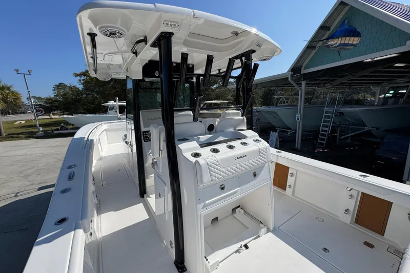 Slide: The Image of 2026 Caymas 30 CT boat with sleek design and modern features, docked outdoors. - 36
