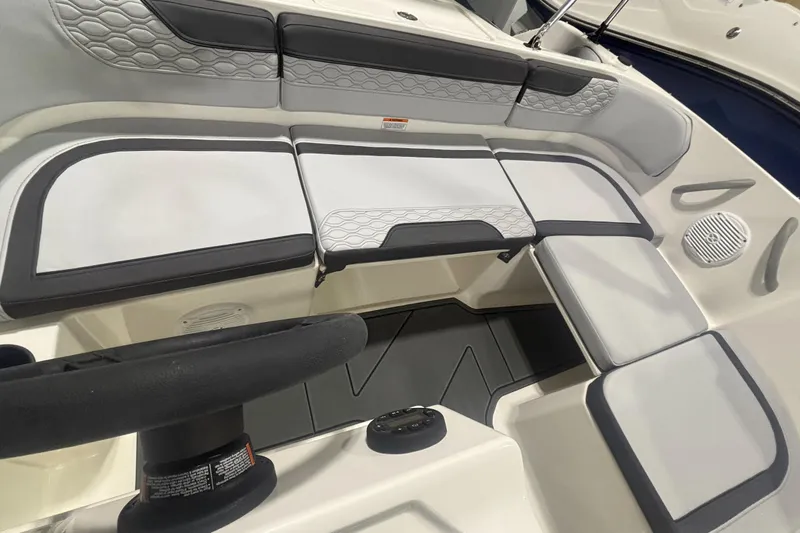 Slide: The Image of 2026 Bayliner M17 boat interior with cushioned seating and modern design. - 4