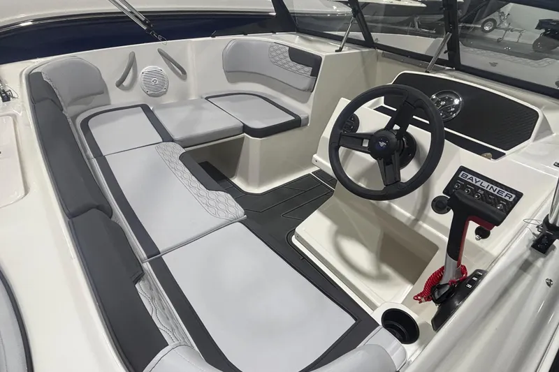 Slide: The Image of 2026 Bayliner M17 boat interior with modern steering and seating design. - 9