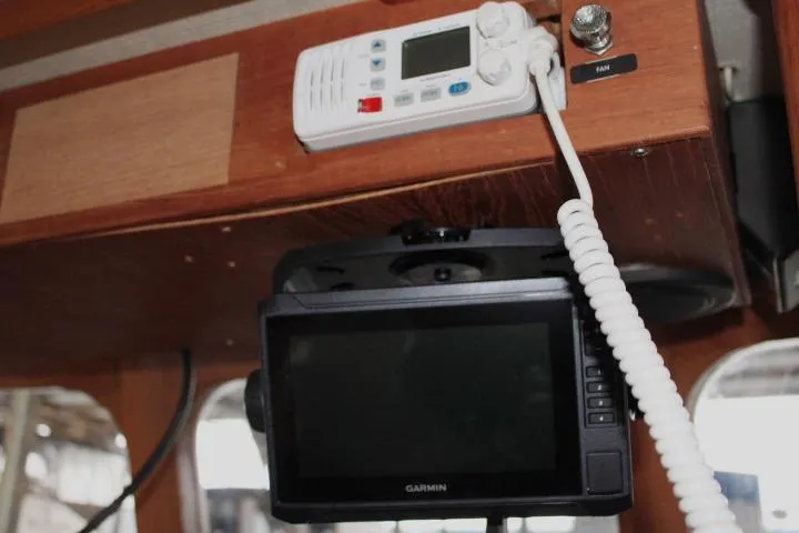 Slide: The Image of 1976 CHB Double Cabin Trawler interior with Garmin navigation and communication equipment. - 49