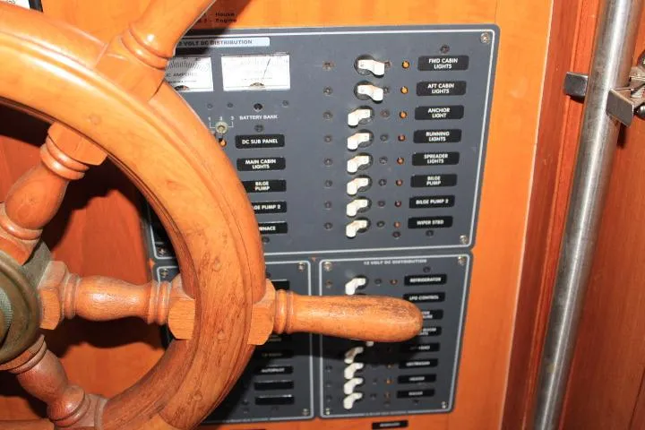 Slide: The Image of Wooden steering wheel and control panel of a 1976 CHB Double Cabin Trawler. - 50