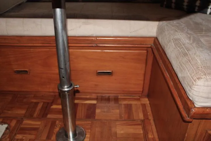 Slide: The Image of Interior of 1976 CHB Double Cabin Trawler with wooden flooring and built-in storage. - 66