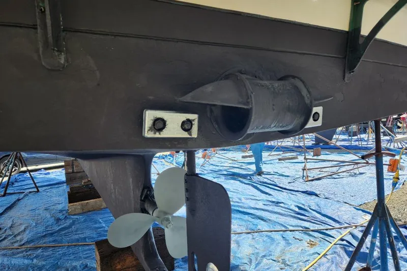 Slide: The Image of 1976 CHB Double Cabin Trawler propeller and hull detail in dry dock. - 8