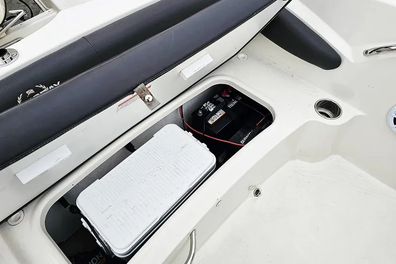 Slide: The Image of 2019 Stingray 191 DC boat interior storage with battery and cooler. - 10