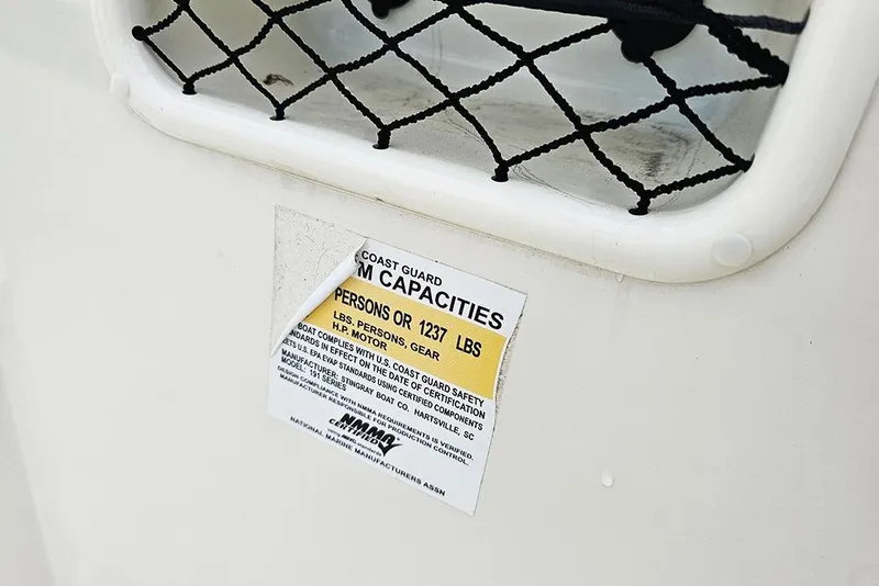 Slide: The Image of 2019 Stingray 191 DC boat capacity label, showing weight and passenger limits. - 13