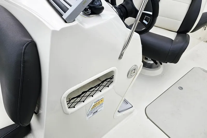 Slide: The Image of 2019 Stingray 191 DC boat interior with steering wheel and seating details. - 18