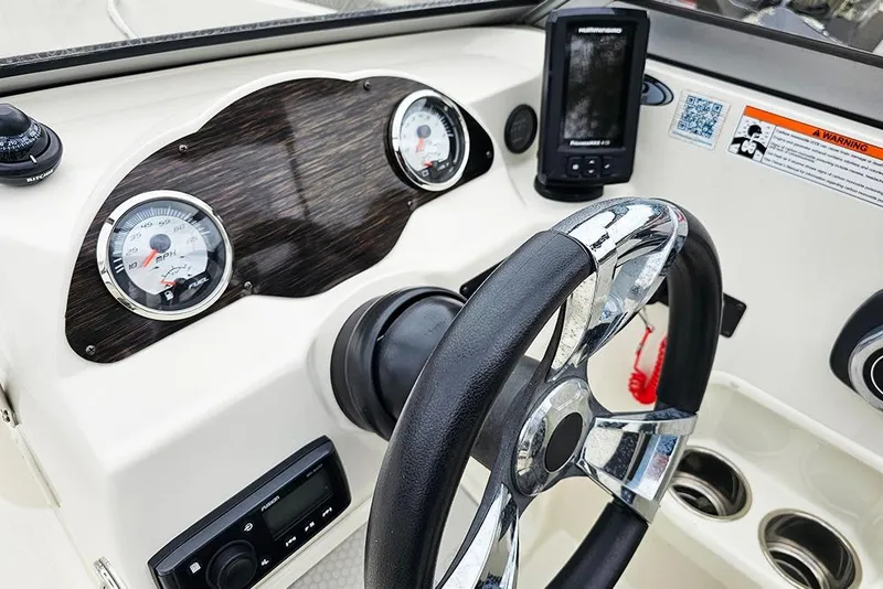 Slide: The Image of 2019 Stingray 191 DC dashboard with steering wheel, gauges, and navigation system. - 22