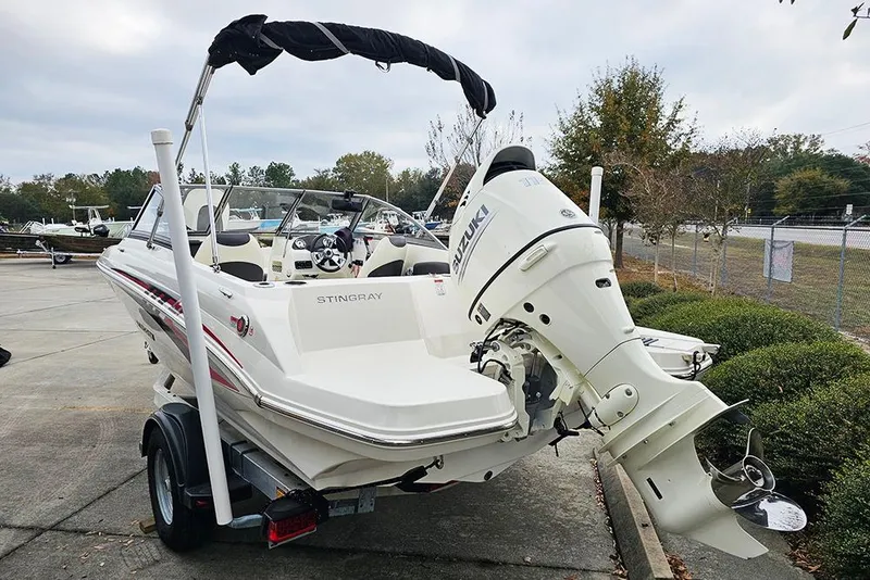 Slide: The Image of 2019 Stingray 191 DC boat with Suzuki outboard motor on trailer. - 4