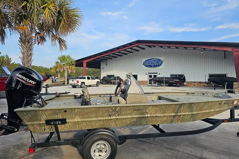 Slide: The Image of 2024 Tracker Grizzly 1754 SC boat with Mercury engine at dealership. - 6