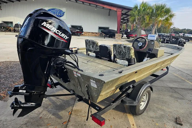 Slide: The Image of 2024 Tracker Grizzly 1754 SC boat with Mercury engine on trailer. - 7