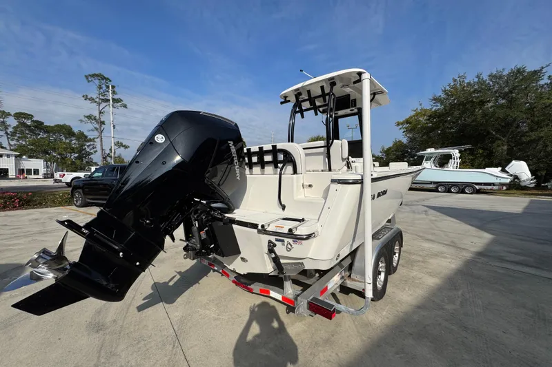 Slide: The Image of 2026 Sea Born LX24 Center Console boat with Mercury outboard engine on trailer. - 12