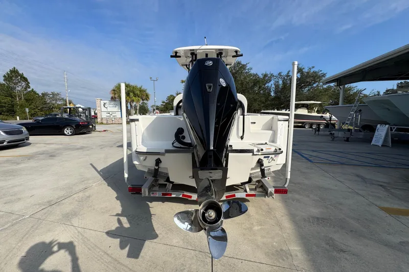 Slide: The Image of 2026 Sea Born LX24 Center Console boat on trailer, rear view with outboard motor. - 14