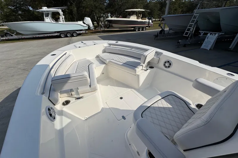 Slide: The Image of 2026 Sea Born LX24 Center Console boat interior with cushioned seating and modern design. - 20