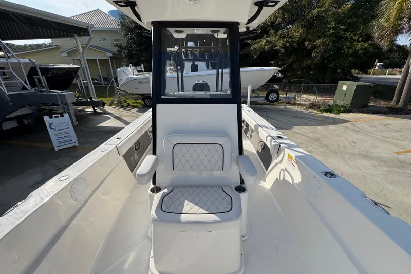 Slide: The Image of 2026 Sea Born LX24 Center Console boat interior with seating and console view. - 24