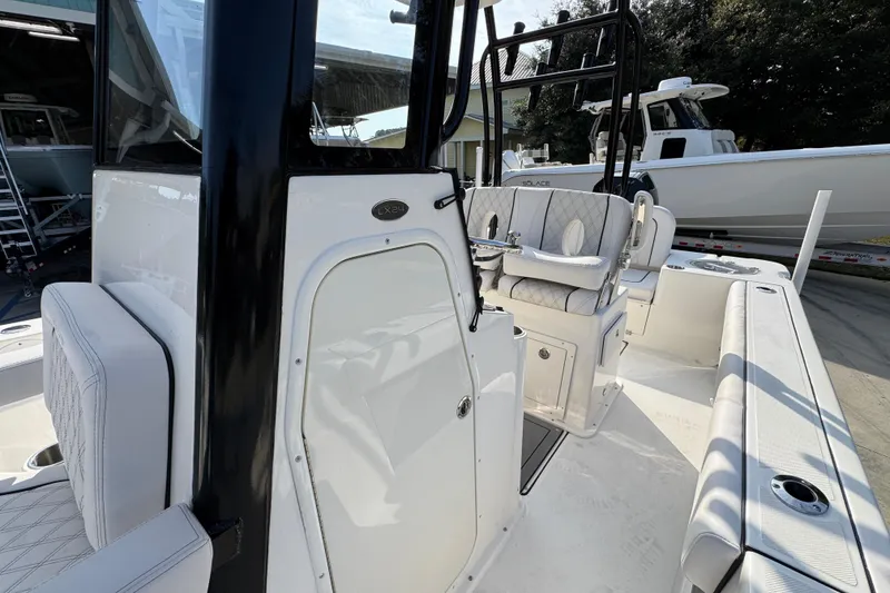 Slide: The Image of 2026 Sea Born LX24 Center Console boat interior with seating and control panel. - 25