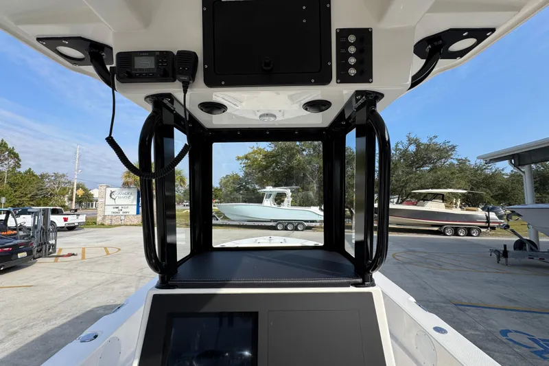 Slide: The Image of 2026 Sea Born LX24 Center Console interior view with modern controls and outdoor setting. - 35