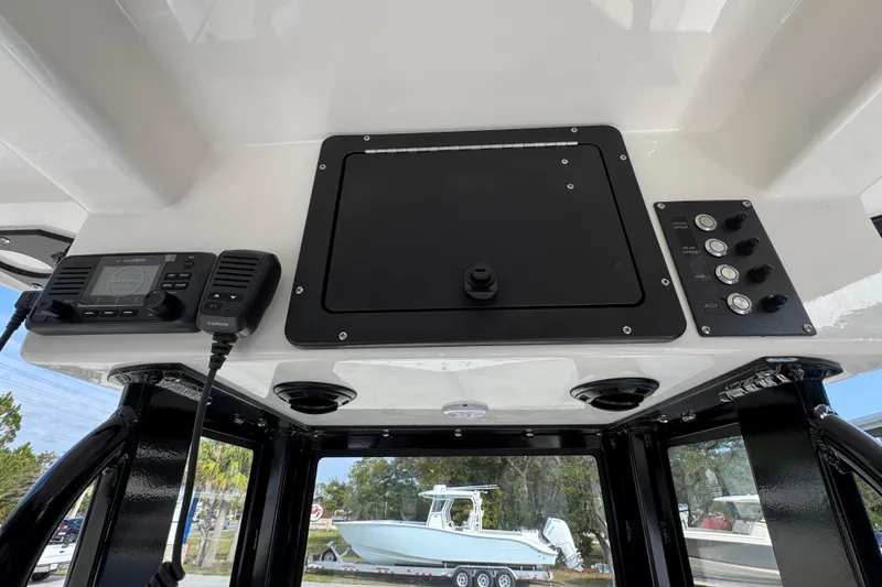 Slide: The Image of 2026 Sea Born LX24 Center Console dashboard with Garmin radio and control panel. - 36