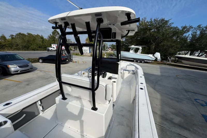 Slide: The Image of 2026 Sea Born LX24 Center Console boat in parking lot, showcasing sleek design and modern features. - 41