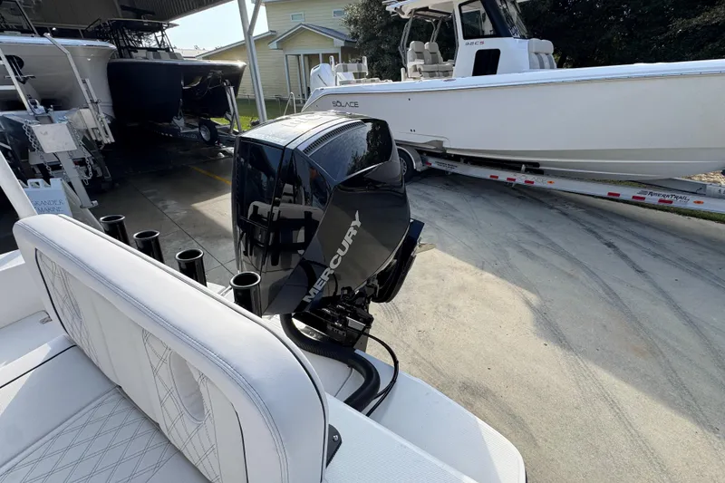 Slide: The Image of 2026 Sea Born LX24 Center Console boat with Mercury engine, parked on a trailer. - 45