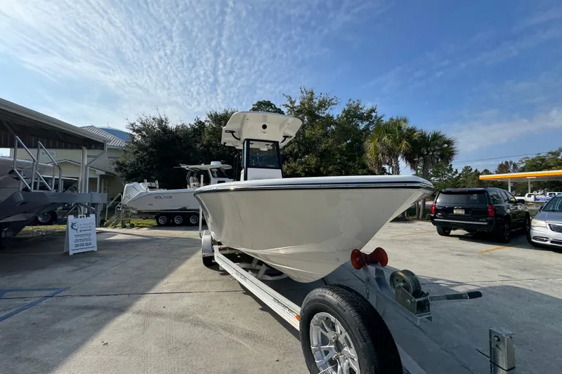 Slide: The Image of 2026 Sea Born LX24 Center Console boat on trailer in parking lot. - 7